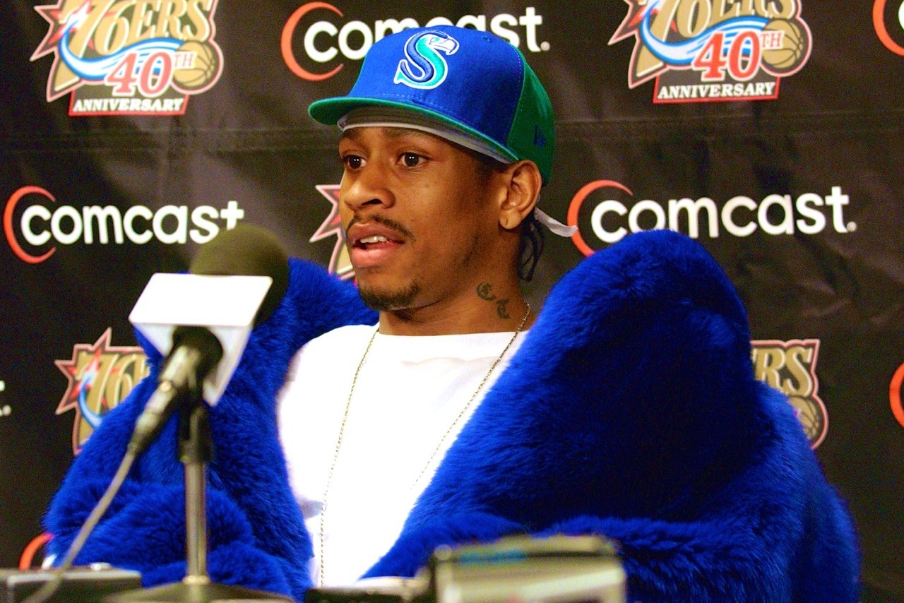 PHILADELPHIA - DECEMBER 4: Guard Allen Iverson #3 of the Philadelphia 76ers speaks at the post game press conference wearing a Seattle Seahawks cap after the 76ers defeated the Boston Celtics at the First Union Center on December 4, 2002 in Philadelphia, Pennsylvania. The 76ers won 99-93. NOTE TO USER: User expressly acknowledges and agrees that, by downloading and or using this photograph, User is consenting to the terms and conditions of the Getty Images License Agreement. Mandatory copyright notice: Copyright NBAE 2002 (Photo by Jesse D. Garrabrant/ NBAE/ Getty Images)